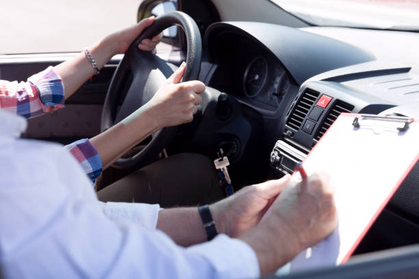 Learning to drive a car. Driving school. Driver education.